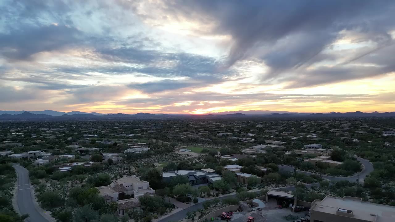 Aerial view of a Tucson-area desert neighborhood at sunset