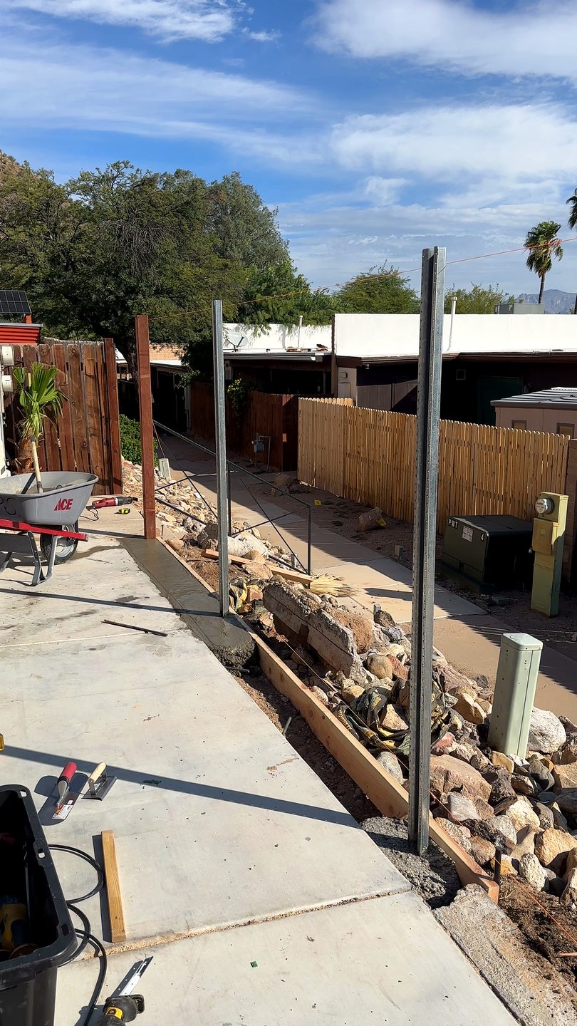 Setting galvanized steel fence posts in concrete