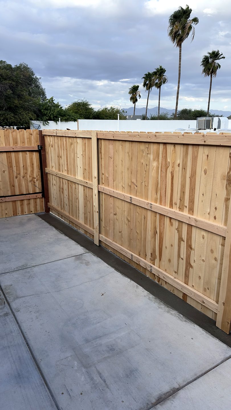 Finished fence with a welded steel gate in Tucson