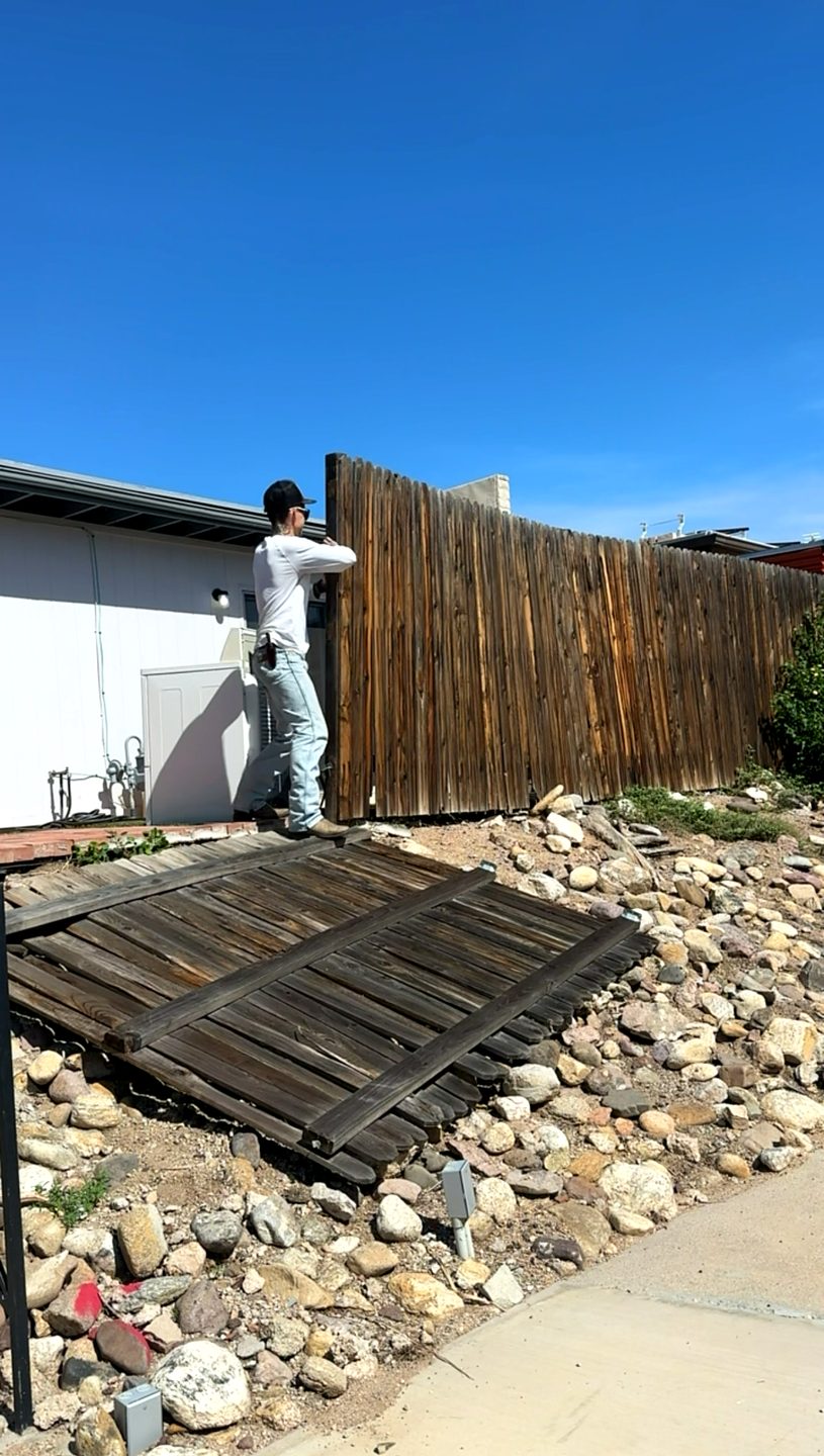Tearing out an old fence in Tucson