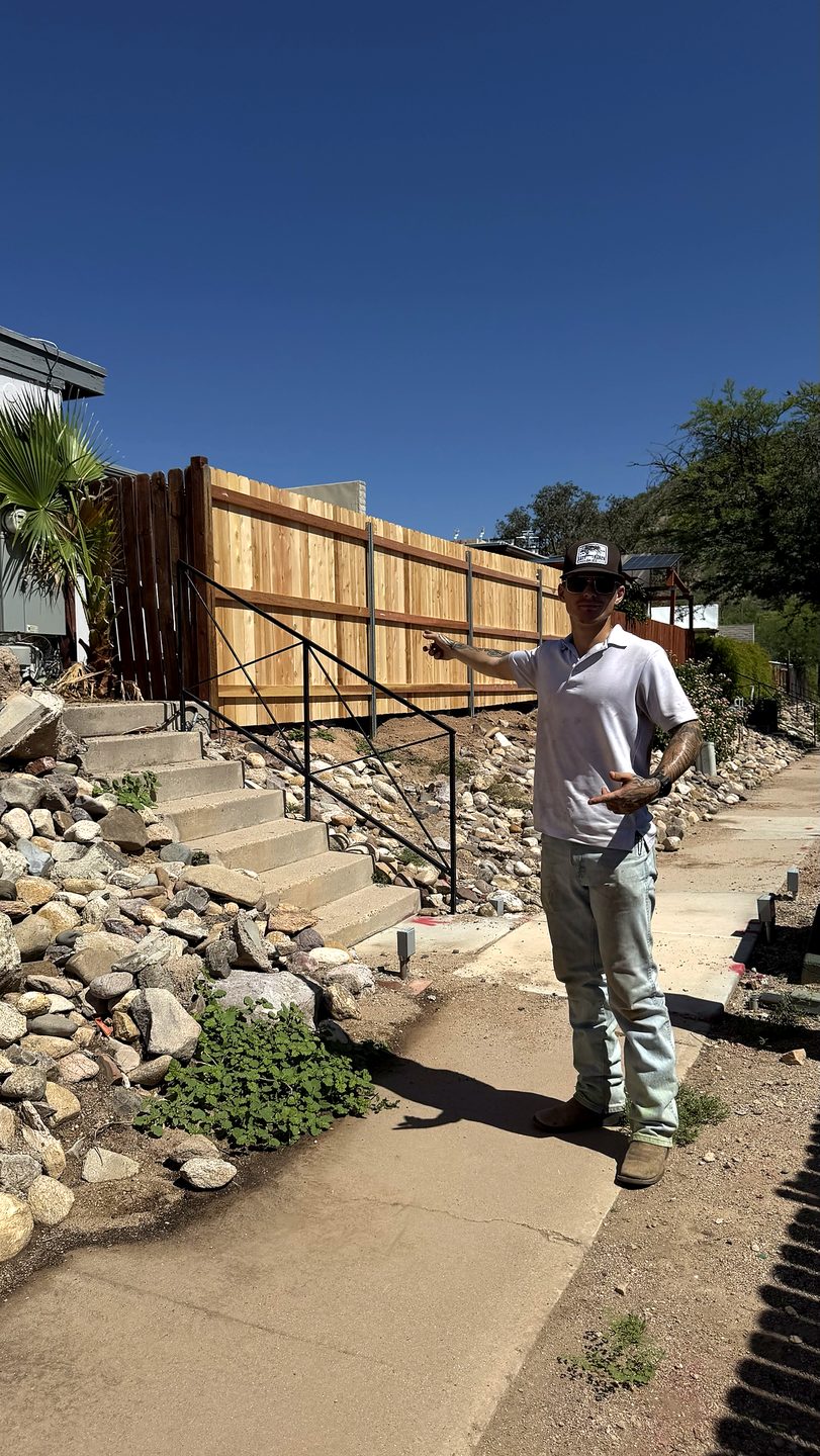 Ben Garcia on site planning a fence in Tucson